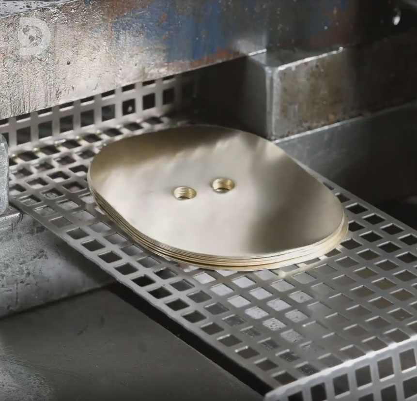 Brass sheets on how motorcycle goggles are made.